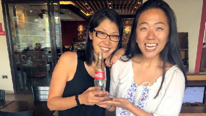 Leighanne Oh (2011, right) traveled to Kampala, Uganda, where she was able to share a Coke with Kim Rash (1990, left)! Kim and her husband Bob moved to Kampala last year.