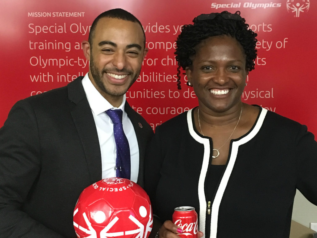 Chad Jones (2001) and Angela Harrell (1990) shared a Coke at a Special Olympics event in Washington, DC.