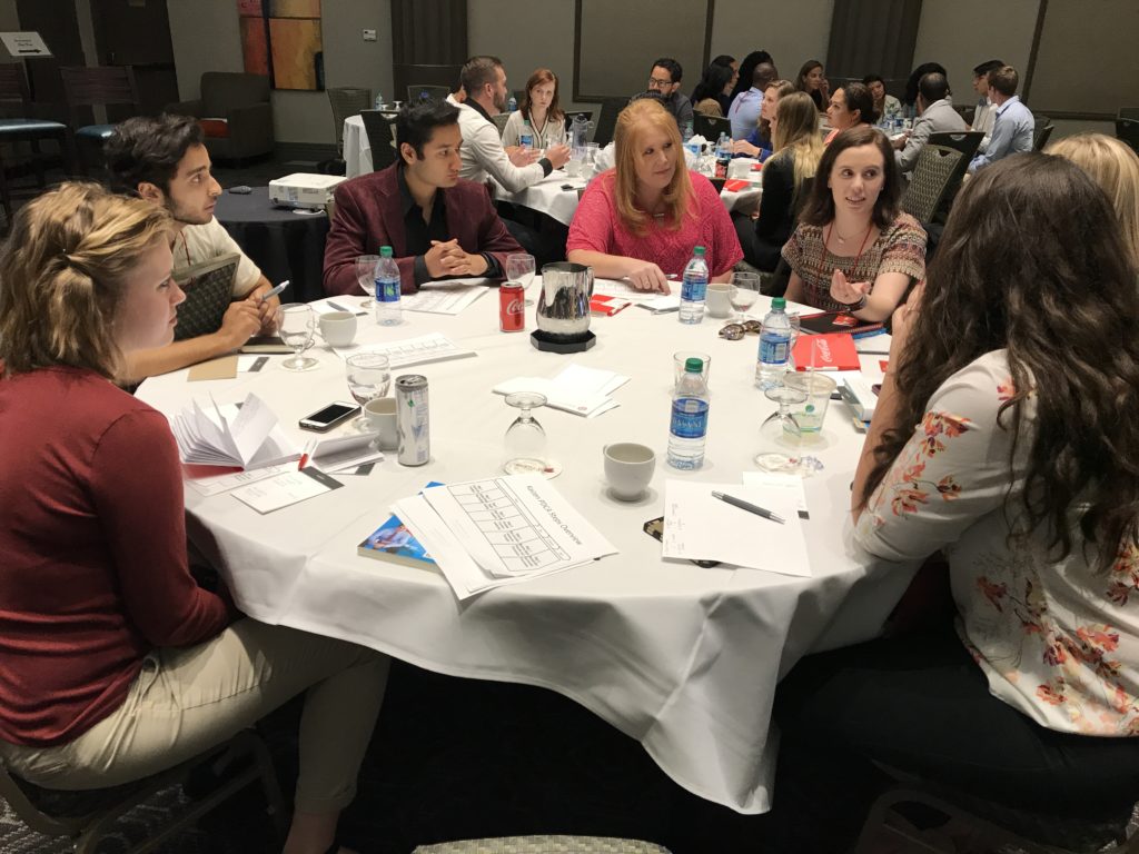 Scholars at the 2017 Denver Service Summit discuss their individual service plans to improve their communities post-Summit. Left to right: Deena Whitwam (2015 Scholar), Akbar Khan (2014), George Pandya (2016), Kari Philbeck (1994), Harriet Pryor (2016), Kaitlyn Chana (2009), and Amy Pyle (2013).