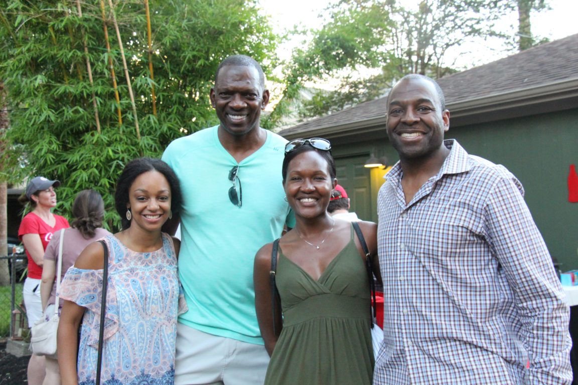 Service Day participants Ariel Nixon (2010 Scholar), Morris Smith (Coca-Cola Southwest Beverages) and wife Tecoa Smith, and Matt Turner (1992) enjoy a cookout post-service.