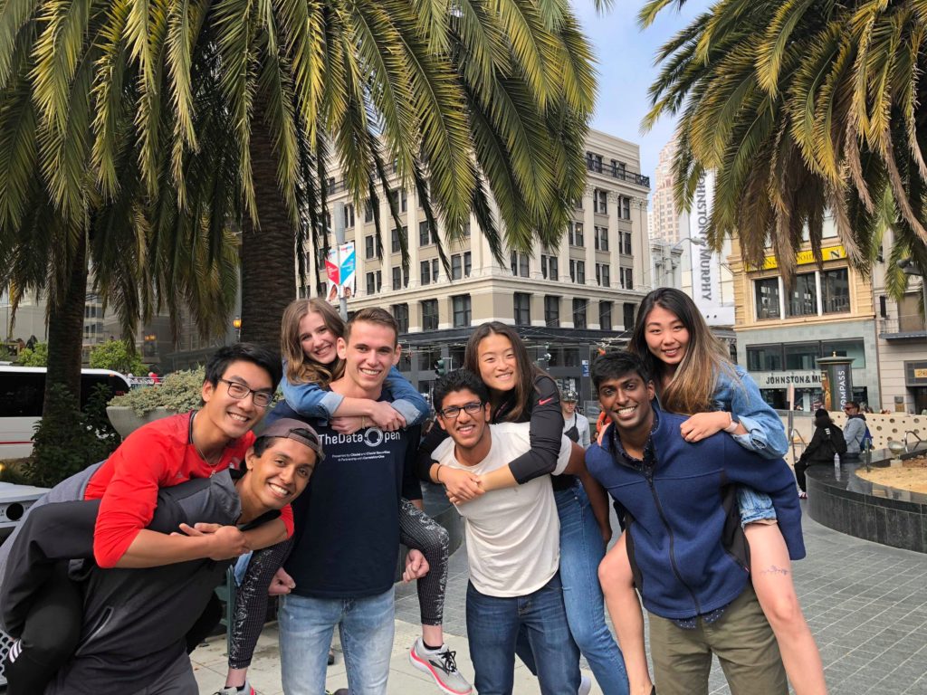 2016 Scholars cheered on fellow Scholars Nathan, Eamon, and Grace as they ran the San Francisco Half marathon. Left to Right First Row: Raghvendra Pai, Eamon Bracht, Shrey Agarwal, and Krishna Gorrepati. Names Left to Right On Backs: Nathan Chiu, Grace Knight, Emily Tan, and Joy Hsu.