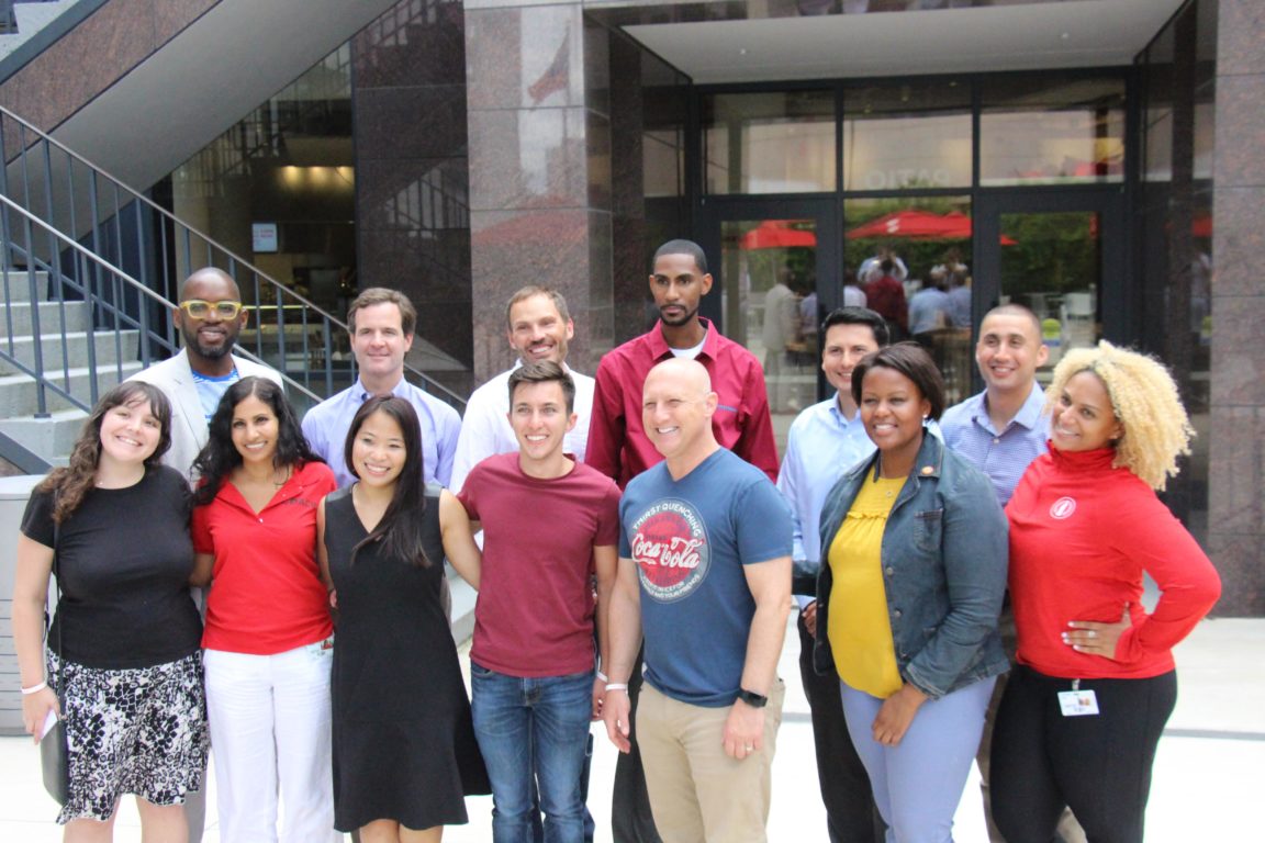 Alumni coaches at Coca-Cola Headquarters in Atlanta for training. At the top of the page, coaches train at CCL's headquarters in San Diego.