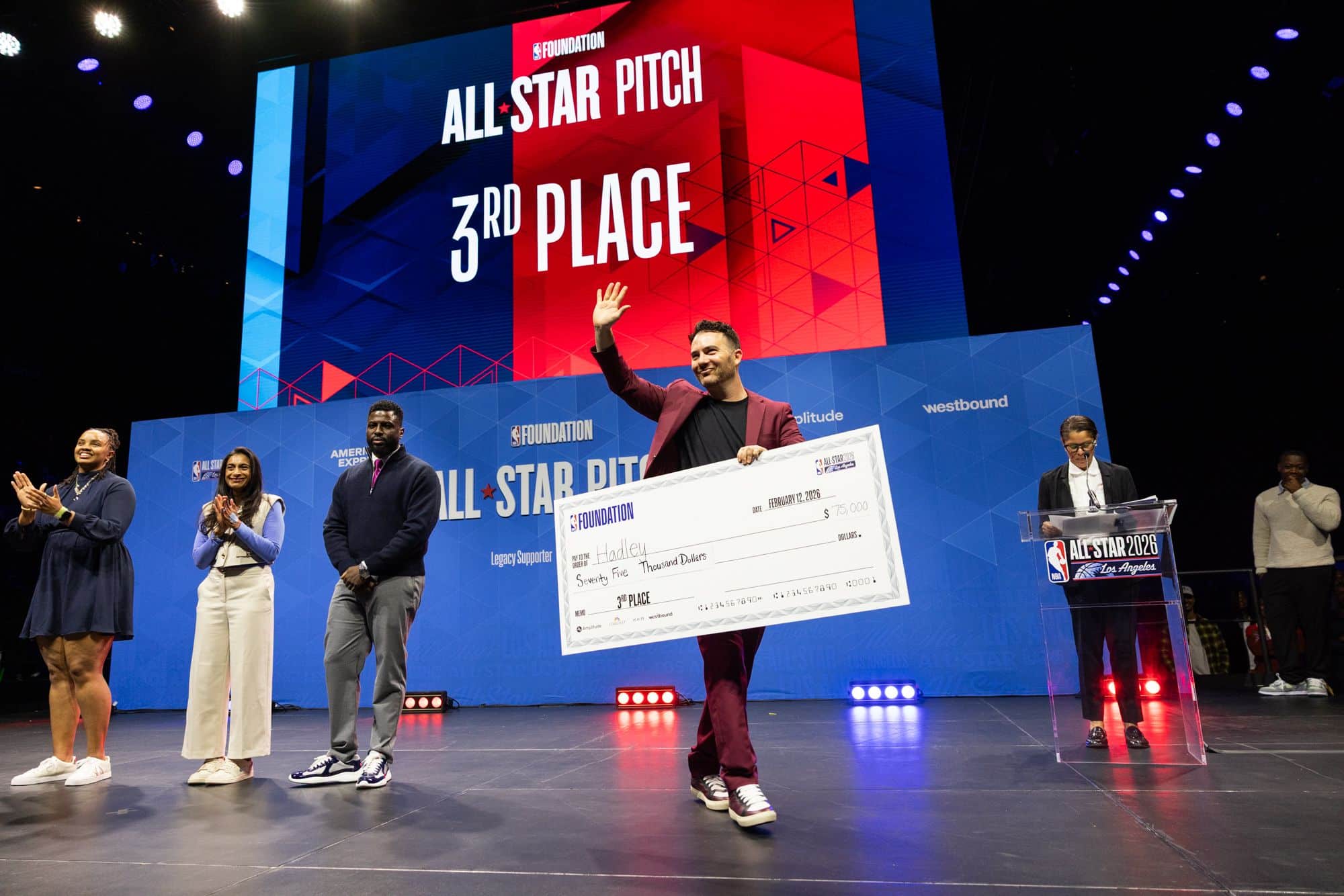 Alumni Accolades_Yosh Miller and big check